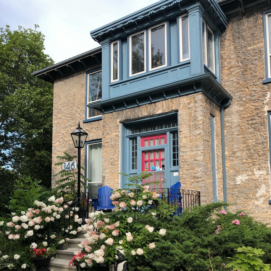 A house with a blue door and windows.