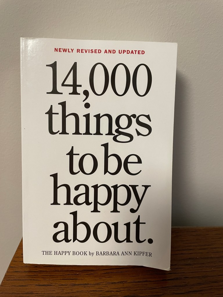14,000 Things to Be Happy About by Barbara Ann Kipfer book cover.